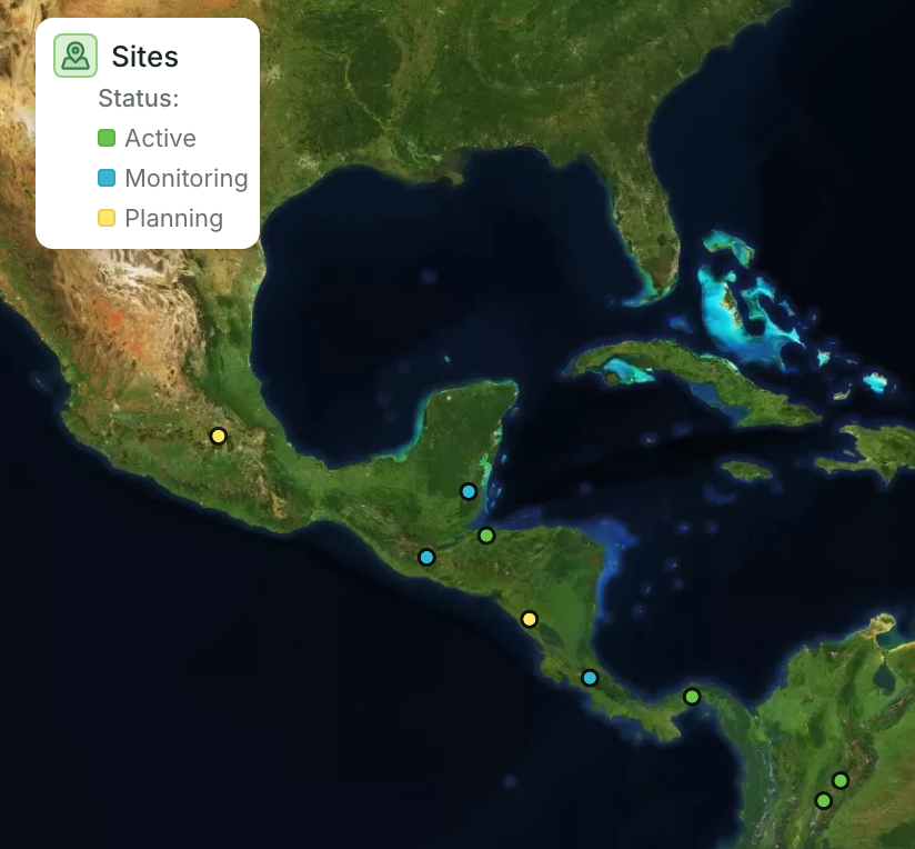 Sites colored by Status: the legend lists Active, Monitoring and Planning with their colors, and each point on the map takes the color of its status